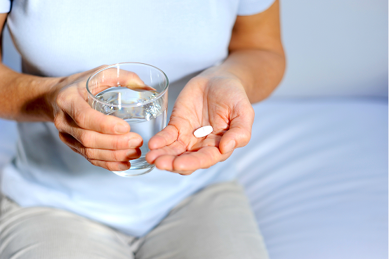 Close-up of a patient holding medication